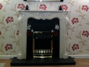 Photo - Decorative fireplace, wall-papering and laminate flooring for a Penwortham property
