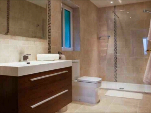 Photo - Luxurious fitted bathroom with walk-in shower installed as an en-suite to a hotel bedroom