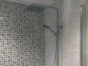 Fitted Shower - Contemporary fitted dual shower with feature tiling and ceiling for a Cleveleys home, near Blackpool