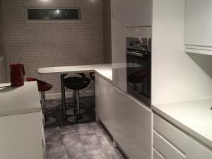 Breakfast Bar - Stylish breakfast area added to modern fitted kitchen with colour co-ordinated stools