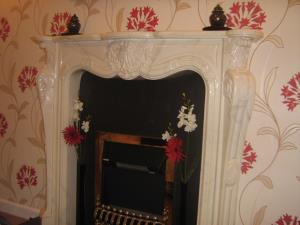 Wall-papering - Distinctive decorative wall-paper applied to a wall with a feature fireplace in a home in Penwortham, Preston